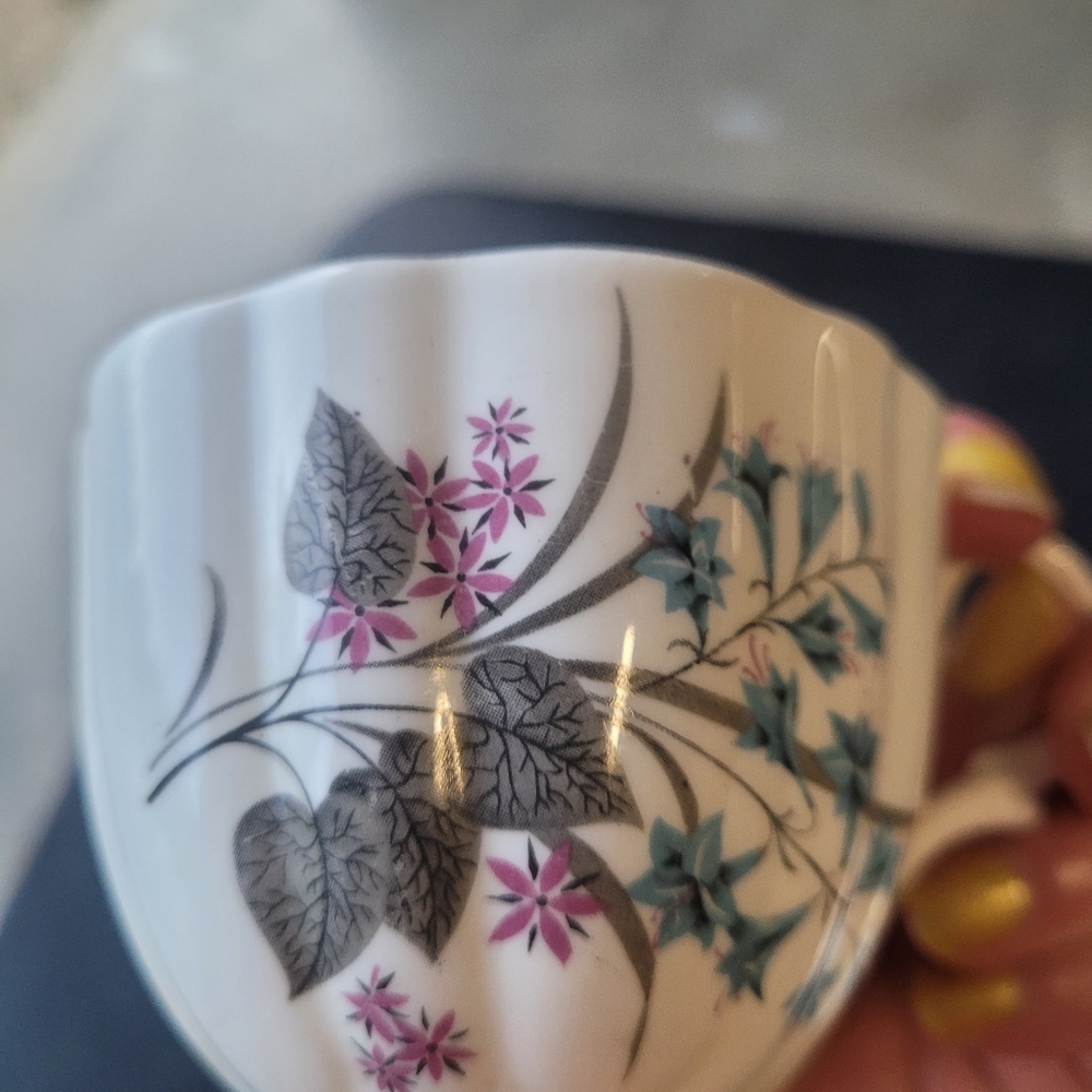EUC Beautiful Bone China floral teacup with matching saucer.